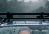 Car Roof Racks for Adventurers: Which One Should You Get? Panicked face in rainy SUV with wobbly rack.